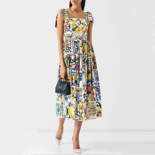 Maxi-jurk met bloemenprint spaghettibandjes strik en uitlopende rok