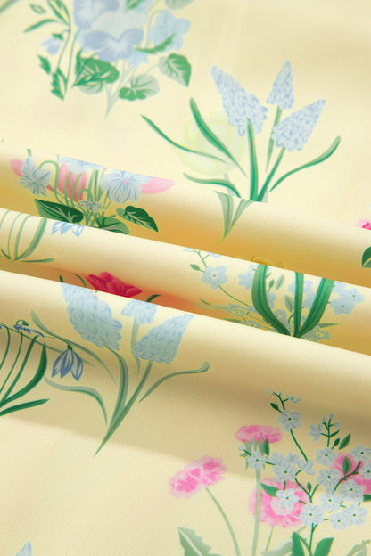 Roze midi-jurk met bloemenprint contrasterende bies strikbandjes en hoge taille