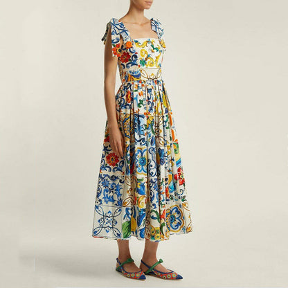 Maxi-jurk met bloemenprint spaghettibandjes strik en uitlopende rok