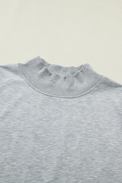 Effen top met hoge hals en korte mouwen osvallend model