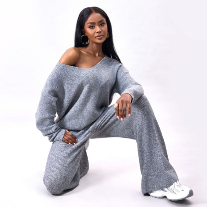 Gebreid geborsteld pak met lange mouwen en verzonken strepen