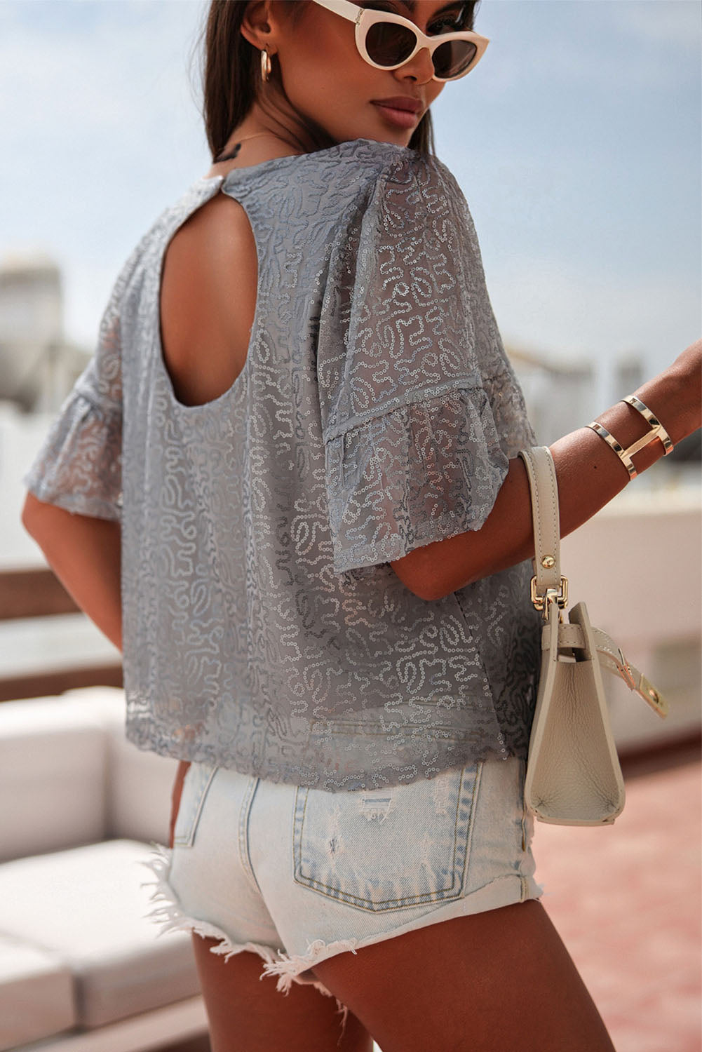 Grijze mesh blouse met ruchesmouwen en pailletten