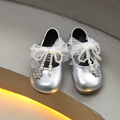 Sweet bow-adorned little leather shoes