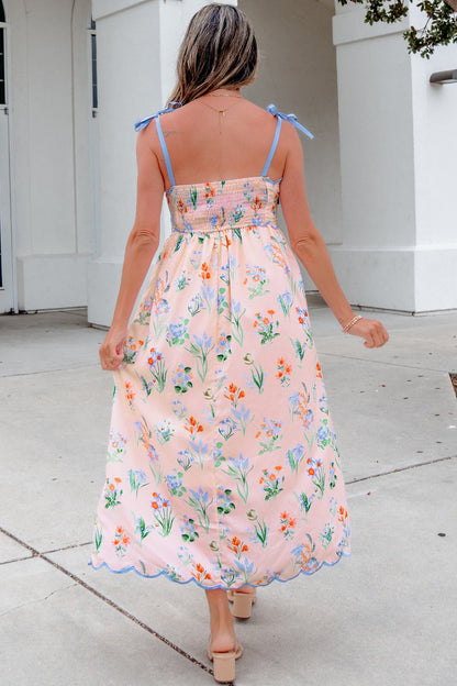 Roze midi-jurk met bloemenprint contrasterende bies strikbandjes en hoge taille