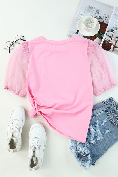 Roze top van tule met pofmouwen