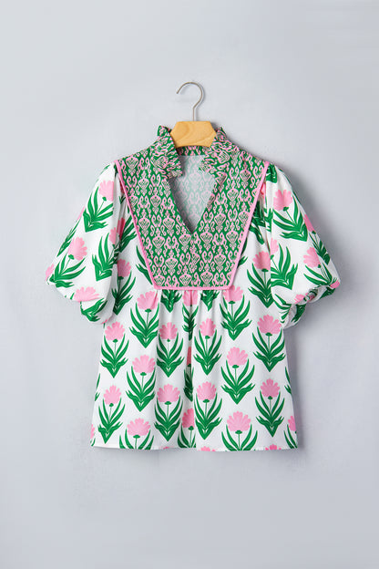 Blouse met veelkleurige bloemenprint pofmouwen contrasterende boord en V-hals