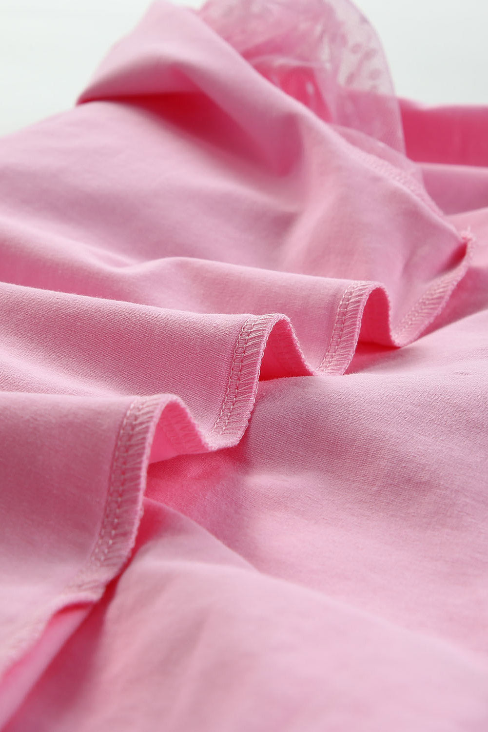Roze top van tule met pofmouwen
