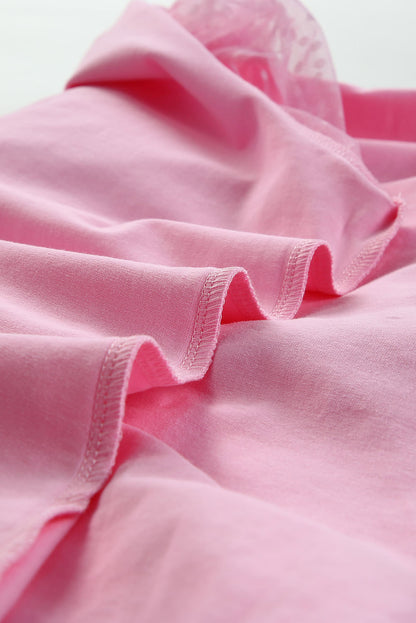 Roze top van tule met pofmouwen