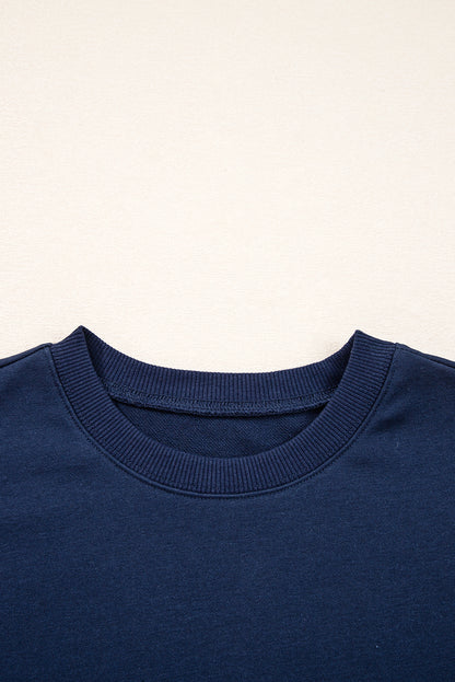 Preppy sweatshirt met strepen op de mouwen en een losse pasvorm