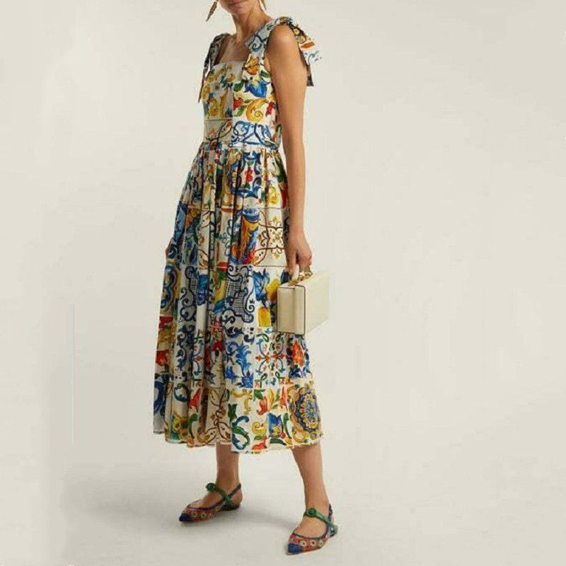 Maxi-jurk met bloemenprint spaghettibandjes strik en uitlopende rok