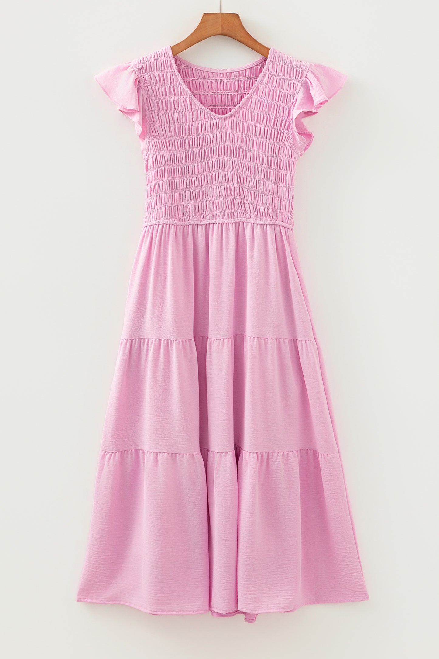 Roze midi-jurk met geplooide top wijd uitlopende mouwen en ruches