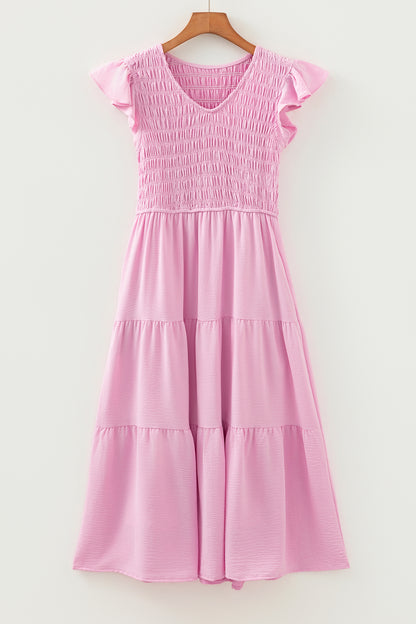 Roze midi-jurk met geplooide top wijd uitlopende mouwen en ruches