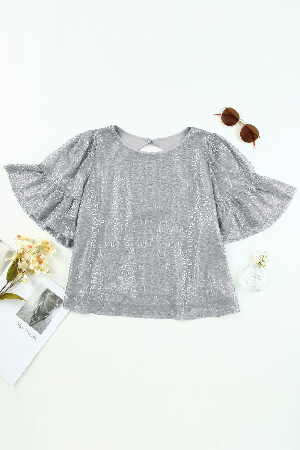 Grijze mesh blouse met ruchesmouwen en pailletten