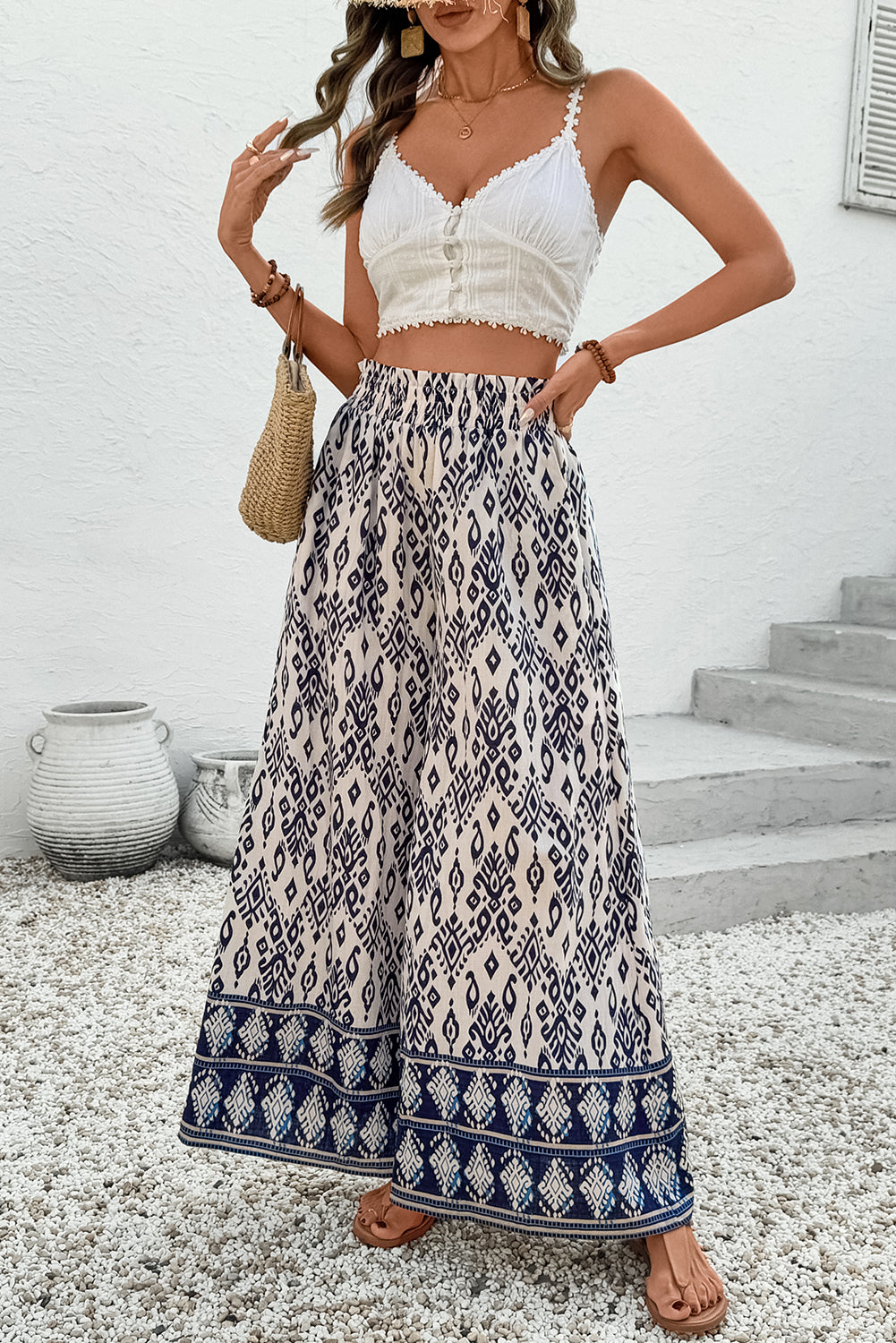 Blauwe broek met etnische print hoge taille en wijde pijpen losse pasvorm