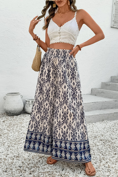 Blauwe broek met etnische print hoge taille en wijde pijpen losse pasvorm