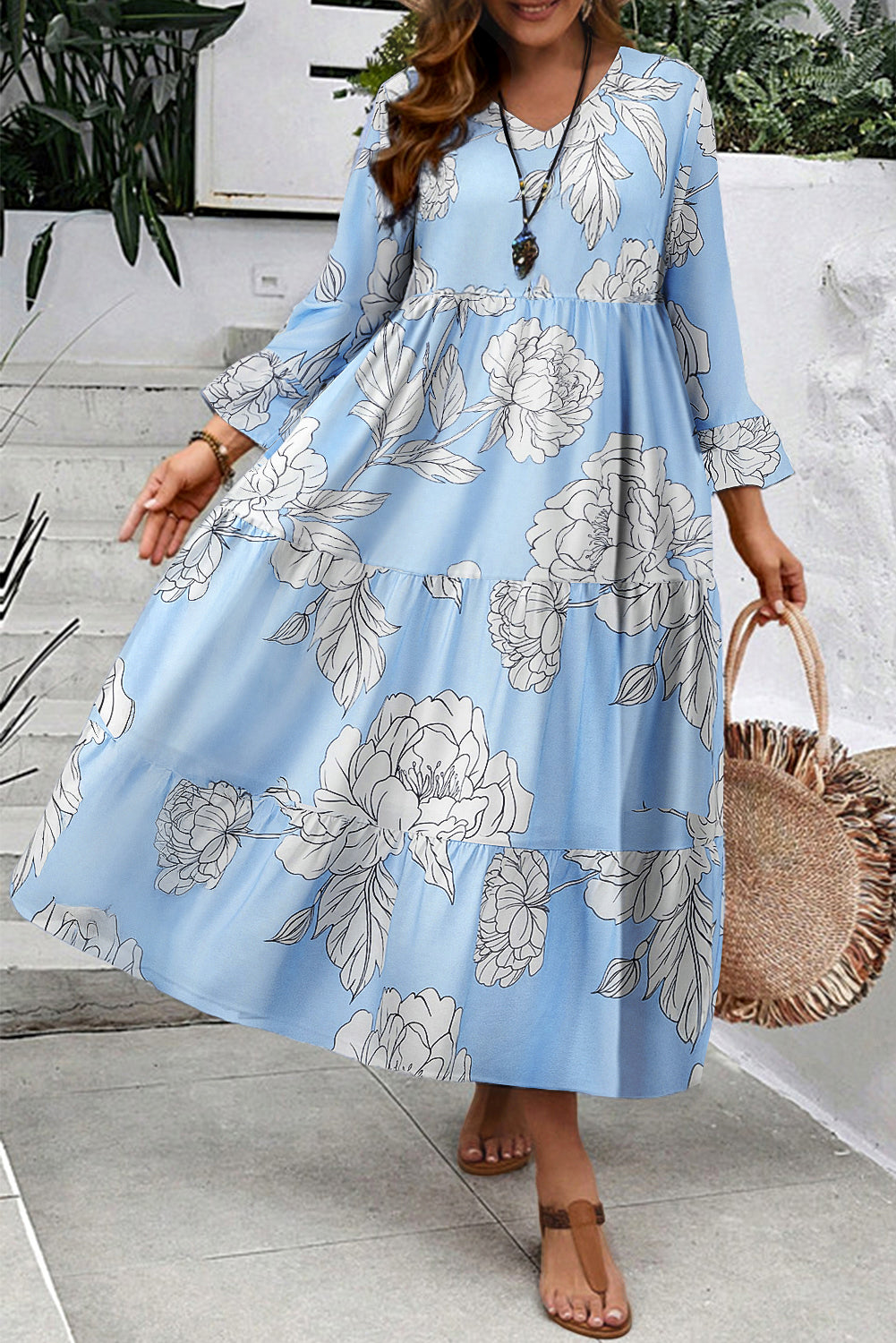Hemelsblauwe maxi-jurk met bloemenprint wijde mouwen V-hals en ruches plus size