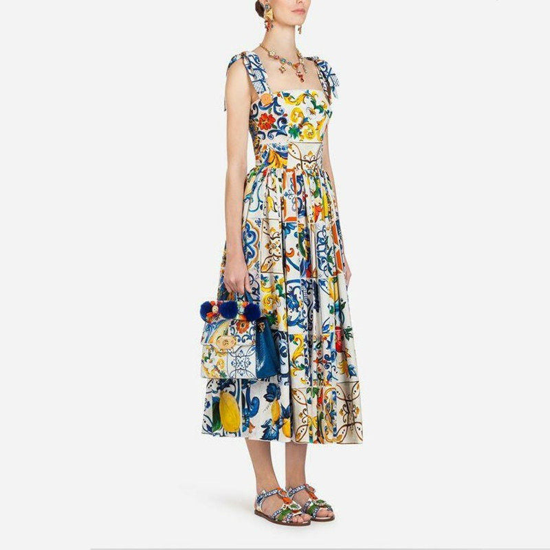 Maxi-jurk met bloemenprint spaghettibandjes strik en uitlopende rok