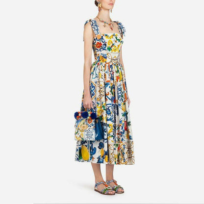 Maxi-jurk met bloemenprint spaghettibandjes strik en uitlopende rok