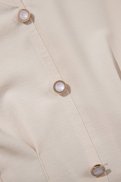 Havermoutkleurige elegante blouse met V-hals lange mouwen en geplooide taille