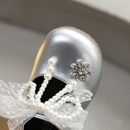 Sweet bow-adorned little leather shoes