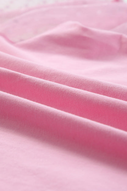Roze top van tule met pofmouwen