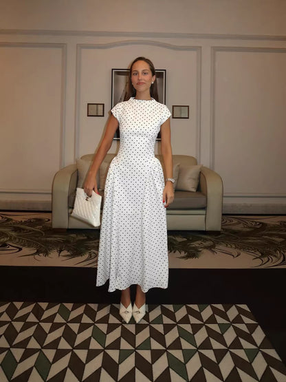 Franse klassieke gebreide mouwloze maxi-jurk met stippen en hoge hals