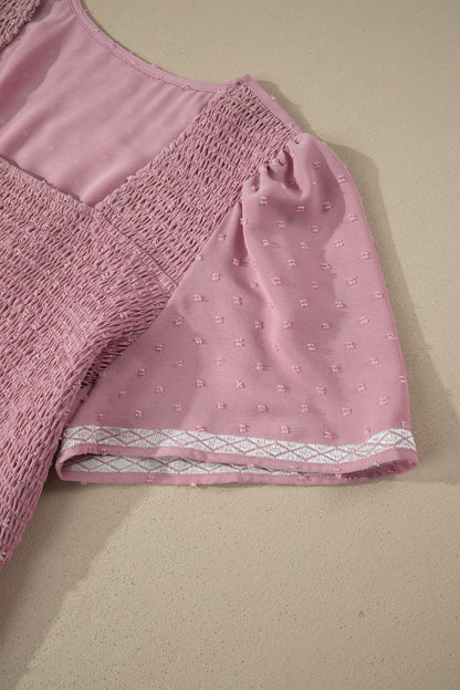 Roze plus size jurk met stippen korte mouwen smockwerk hoge taille en zwierige rok
